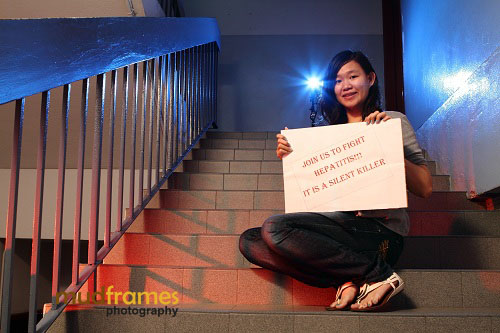 Stamford College's student with World Hepatitis Day 2012 placard message