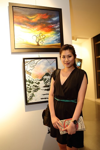 Artist with her painting at the "No Boundary" art exhibition, by The Studio @ KL at Seni Art Gallery, Mont Kiara.