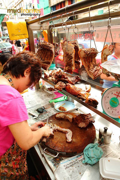 Pork seller at Petaling Street, Kuala Lumpur