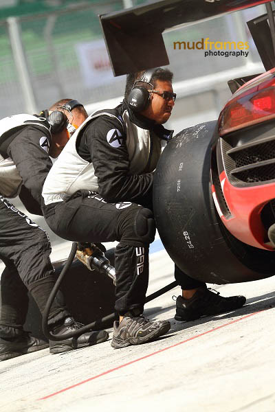 Changing tyres during MMER 2013 race by Audi race crews at pit stop