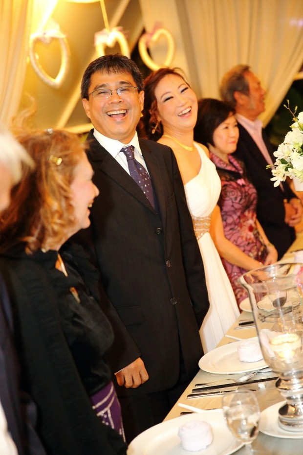 A happy bride and groom during wedding dinner reception at Passion Road