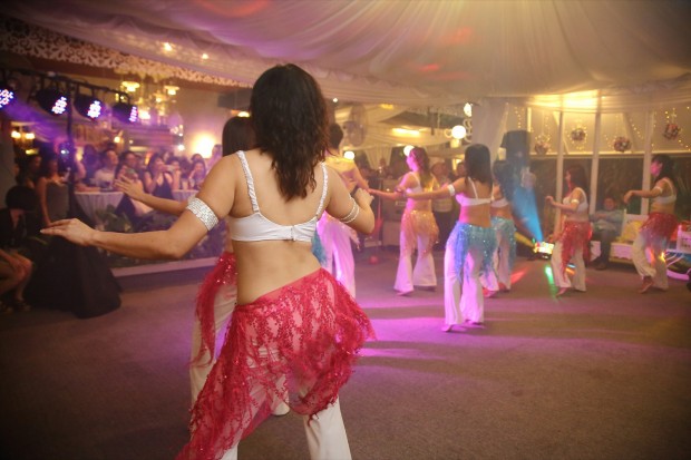 Belly dancing during wedding dinner reception at Passion Road