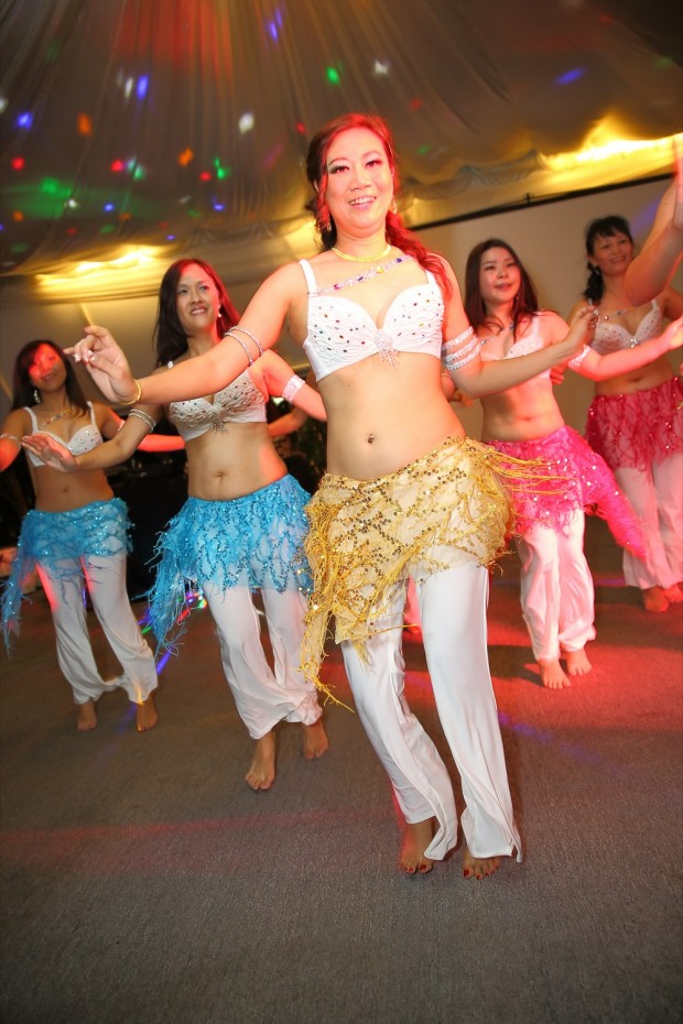 Belly dancing during wedding dinner reception at Passion Road