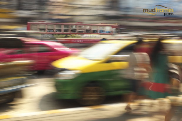 A moving bus through the busy streets of Bangkok, Thailand