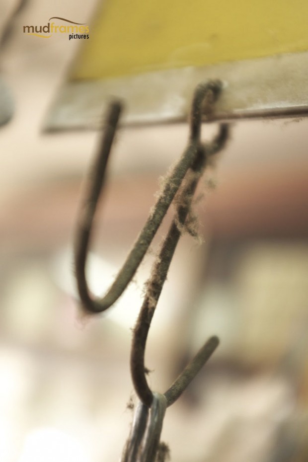 Dusty metal hooks used to hang bags of traditional chinese medicine herbs at Kok Ann medical store at Kuching, Malaysia