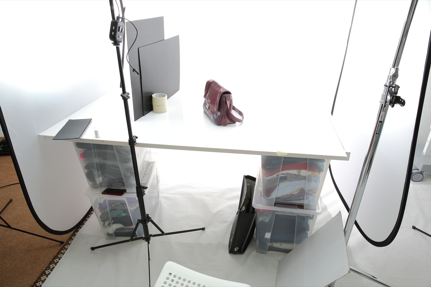 BTS: Professional product photography lighting setup by Mudframes on white background and white acrylic surface
