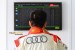 An Audi R8 race driver checks the LCD screen for current race positions during MMER 2013 at Sepang